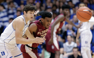 Xavier Rathan-Mayes fights for ball