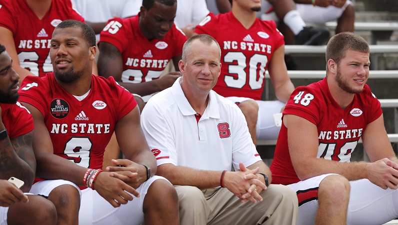 Dave Doeren sitting and smiling