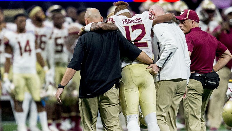 Deondre Francois being helped off the field