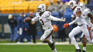 Quin Blanding celebrates