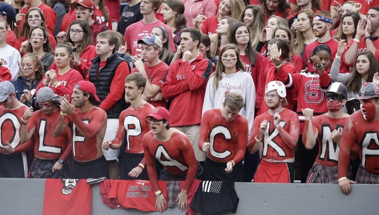 Watch: NC State fans throw objects, spit on referees as they leave ...